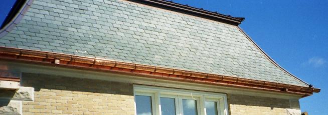 Slate Roof with Hanging Style Copper Gutters by FM Enterprises. All rights reserved.